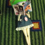 PUDDLE 2009 - A doll reads Haute Doll magazine